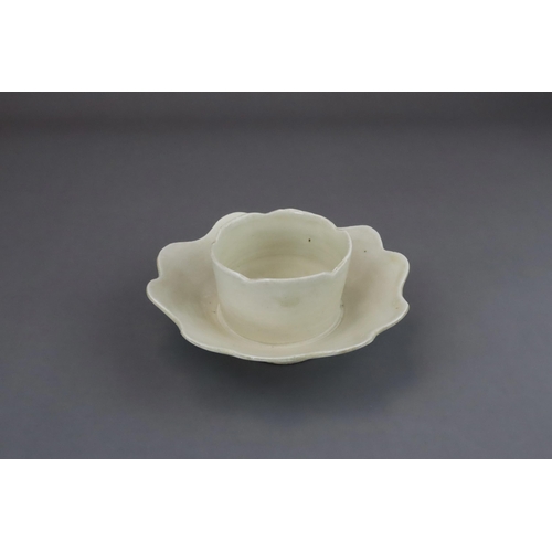 43 - An Extremely Rare Ding-type Lotus-form Cupstand, Five dynasties finely potted, the curved sides of t... 