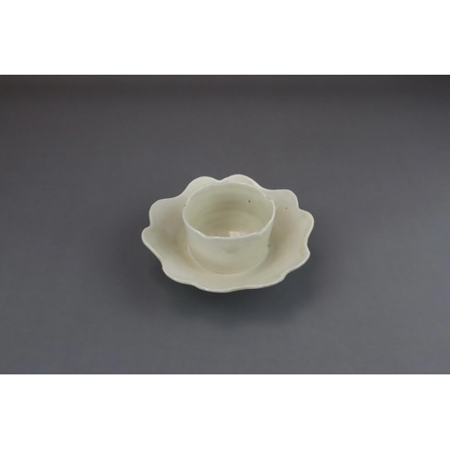 43 - An Extremely Rare Ding-type Lotus-form Cupstand, Five dynasties finely potted, the curved sides of t... 