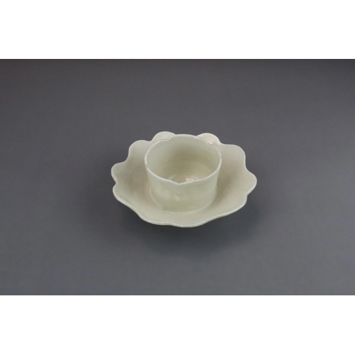 43 - An Extremely Rare Ding-type Lotus-form Cupstand, Five dynasties finely potted, the curved sides of t... 