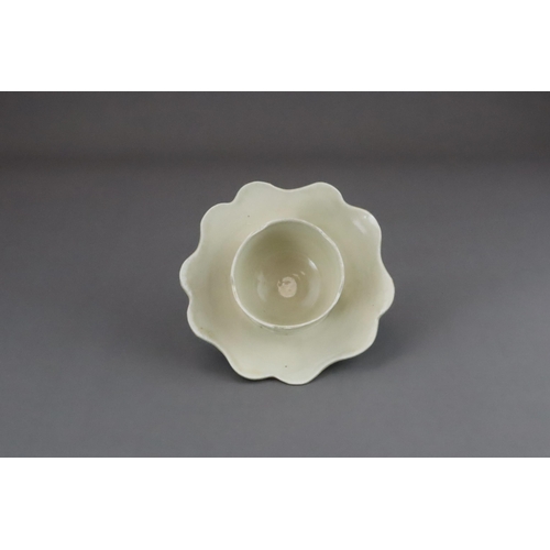 43 - An Extremely Rare Ding-type Lotus-form Cupstand, Five dynasties finely potted, the curved sides of t... 