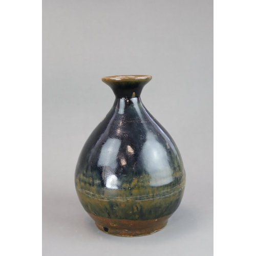 44 - A Black glazed Stoneware Vase, yuhuqunping, Ming dynasty of pear shape, covered with a rich black gl... 