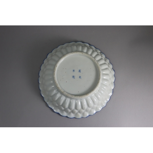 459 - A Blue and White Moulded Dish, 19th century, the interior painted in inky cobalt across the centre, ... 