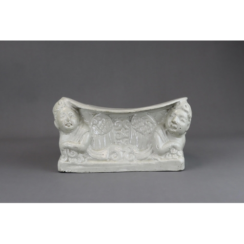 46 - A Rare White-glazed 'Kalavinka' Pillow, Liao dynasty the concave bean-shaped top deftly incised with... 