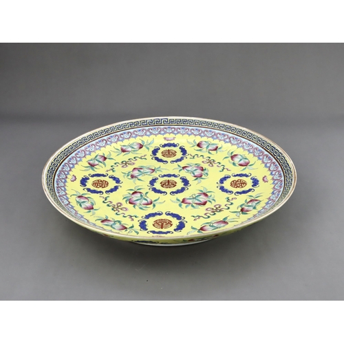 463 - A Yellow  ground famille rose Dish, six character underglaze blue mark of Guangxu and of the period,... 