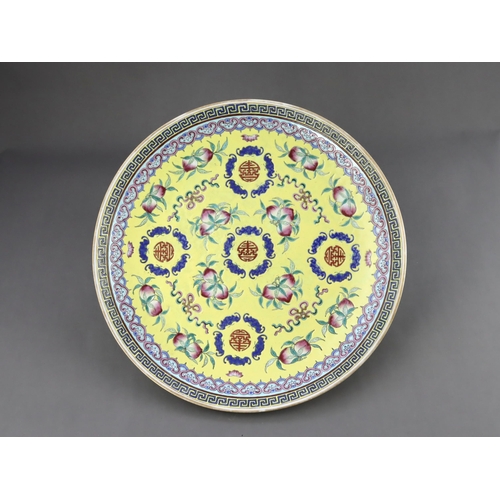 463 - A Yellow  ground famille rose Dish, six character underglaze blue mark of Guangxu and of the period,... 