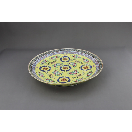 463 - A Yellow  ground famille rose Dish, six character underglaze blue mark of Guangxu and of the period,... 