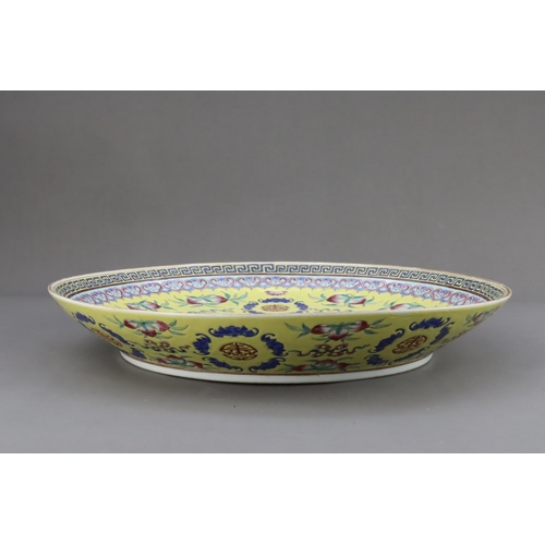 463 - A Yellow  ground famille rose Dish, six character underglaze blue mark of Guangxu and of the period,... 