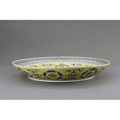 463 - A Yellow  ground famille rose Dish, six character underglaze blue mark of Guangxu and of the period,... 