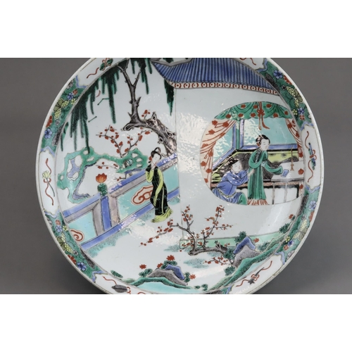 468 - A famille verte Saucer Dish with Figures, late Qing dynasty well painted in rich enamels with a moon... 