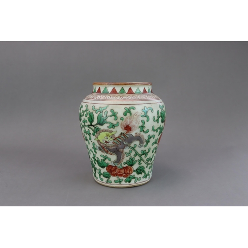 471 - A Wucai Jar with Lions, 19th/20th century, of baluster form, with unglazed base and short neck, the ... 