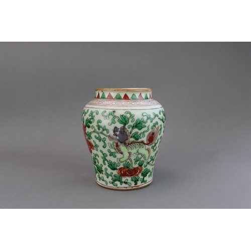 471 - A Wucai Jar with Lions, 19th/20th century, of baluster form, with unglazed base and short neck, the ... 