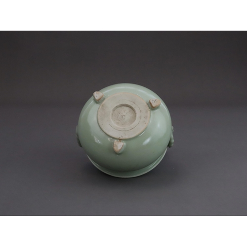 472 - A Celadon Tripod Censer, 18th century, the fine sea green glaze bearing traces of gilding,with strai... 