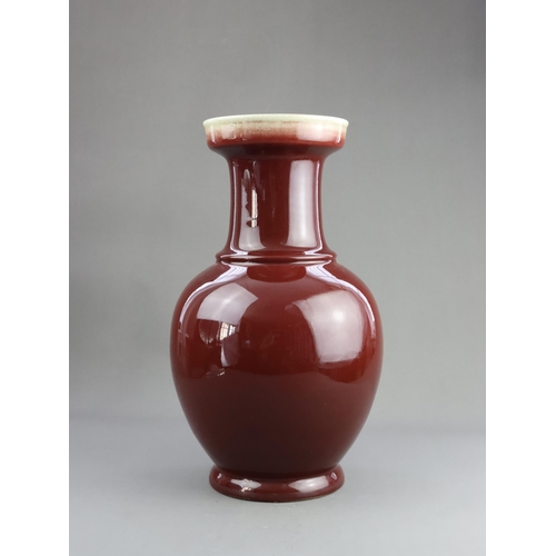 475 - A Red Glazed Vase, 19/20th century, of baluster form with straight neck and galleried rim, covered w... 