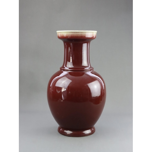 475 - A Red Glazed Vase, 19/20th century, of baluster form with straight neck and galleried rim, covered w... 