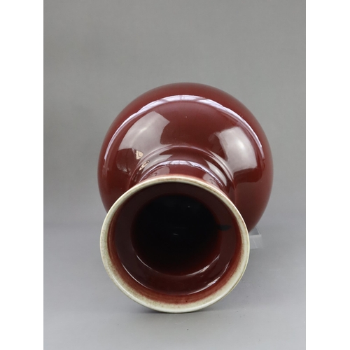 475 - A Red Glazed Vase, 19/20th century, of baluster form with straight neck and galleried rim, covered w... 