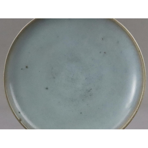 48 - A Jun Blue-glazed Dish, Jin dynasty the gently rounded sides rising from a short recessed foot, cove... 