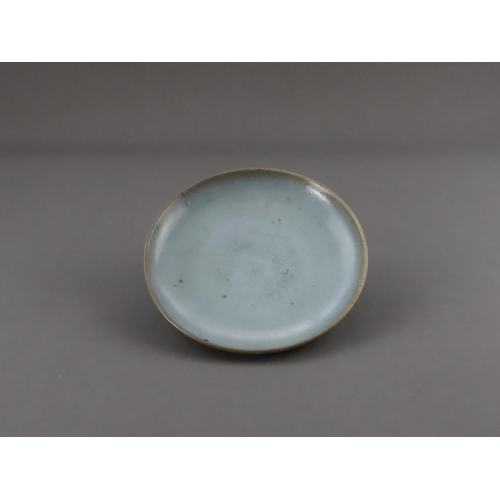 48 - A Jun Blue-glazed Dish, Jin dynasty the gently rounded sides rising from a short recessed foot, cove... 