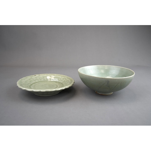 51 - A Carved Celadon Dish and Bowl, Song dynasty and later bowl of rounded shape, carved lotus petals on... 