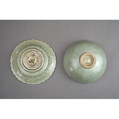 51 - A Carved Celadon Dish and Bowl, Song dynasty and later bowl of rounded shape, carved lotus petals on... 