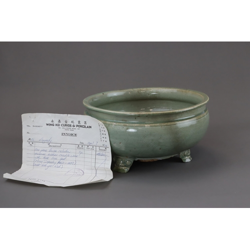 52 - A Longquan Celadon Tripod Incense Burner, Ming dynasty raised on three splayed monster mask feet, ca... 