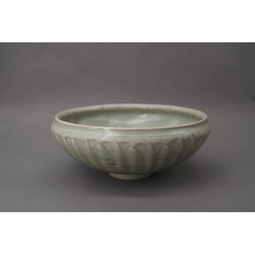 53 - A Longquan Celadon Lotus Bowl, Song dynasty the robustly-potted deep rounded sides rising from a nar... 