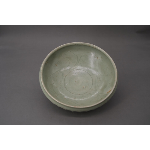 53 - A Longquan Celadon Lotus Bowl, Song dynasty the robustly-potted deep rounded sides rising from a nar... 