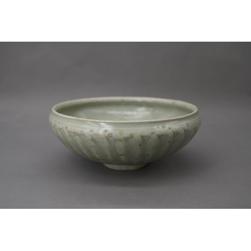 53 - A Longquan Celadon Lotus Bowl, Song dynasty the robustly-potted deep rounded sides rising from a nar... 