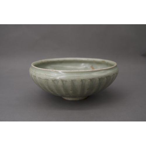 53 - A Longquan Celadon Lotus Bowl, Song dynasty the robustly-potted deep rounded sides rising from a nar... 