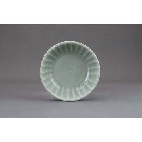 57 - A Longquan Celadon Washer, Yuan dynasty or later the shallow rounded sides divided into fluted lobes... 