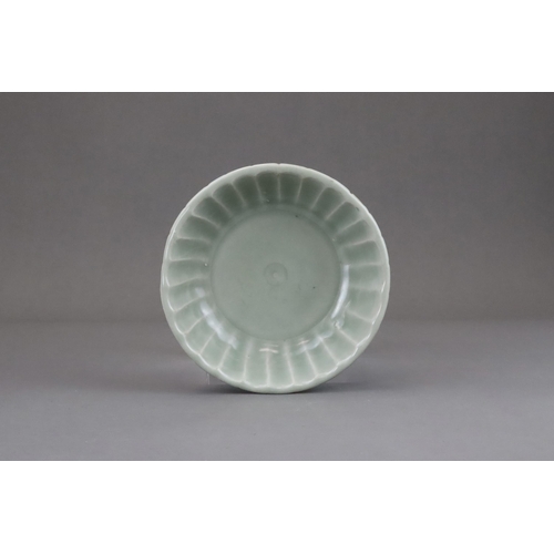 57 - A Longquan Celadon Washer, Yuan dynasty or later the shallow rounded sides divided into fluted lobes... 