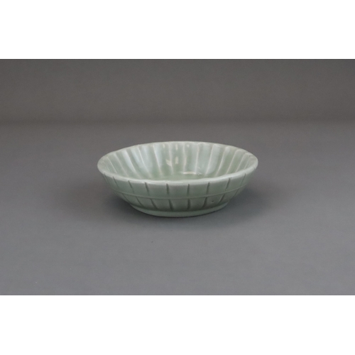 57 - A Longquan Celadon Washer, Yuan dynasty or later the shallow rounded sides divided into fluted lobes... 