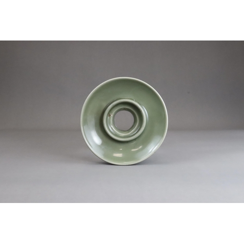 58 - A Longquan Celadon Cupstand, Ming dynasty with rounded sides resting on a thick short foot,with a ro... 