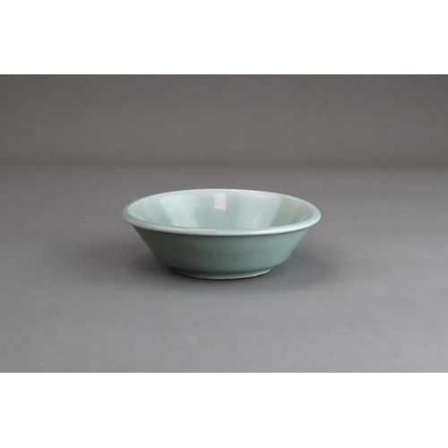 60 - A Longquan Celadon Brushwasher, Song dynasty with straight flared sides rising at an angle from a ta... 