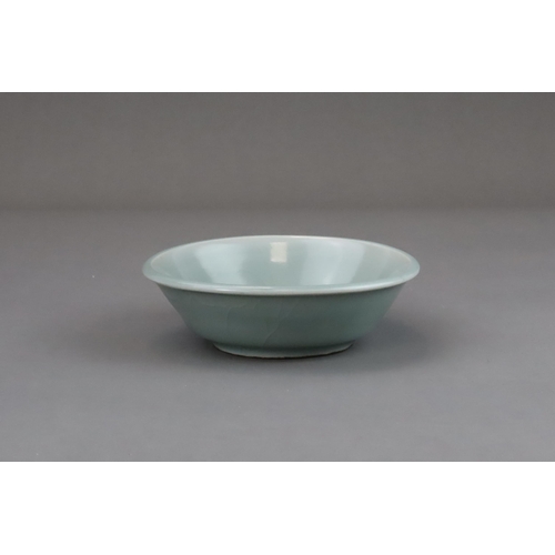 60 - A Longquan Celadon Brushwasher, Song dynasty with straight flared sides rising at an angle from a ta... 