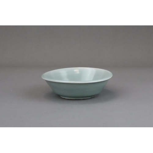 60 - A Longquan Celadon Brushwasher, Song dynasty with straight flared sides rising at an angle from a ta... 