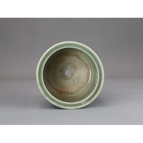 62 - A Longquan Celadon Peony Tripod Censer, early Ming dynasty,   the cylindrical vessel with applied pe... 