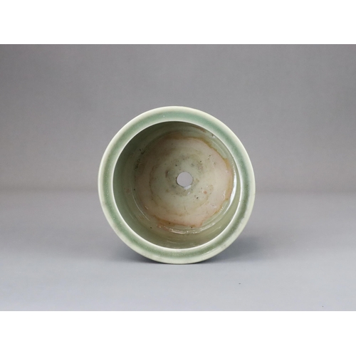 62 - A Longquan Celadon Peony Tripod Censer, early Ming dynasty,   the cylindrical vessel with applied pe... 