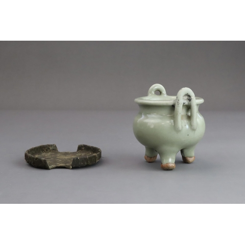 63 - A Longquan Celadon Tripod Incense Burner, Yuan dynasty  the compressed globular body rising from thr... 