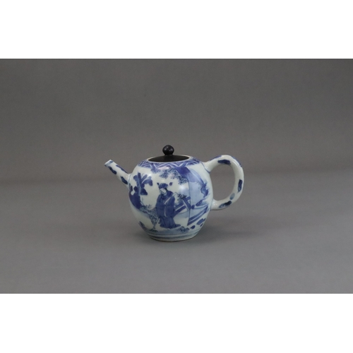 72 - A Blue and White Figural Teapot and wood cover, Chongzhen  painted in soft tones on the globular sid... 