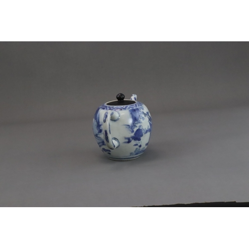 72 - A Blue and White Figural Teapot and wood cover, Chongzhen  painted in soft tones on the globular sid... 