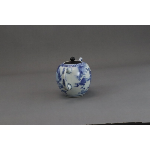 72 - A Blue and White Figural Teapot and wood cover, Chongzhen  painted in soft tones on the globular sid... 