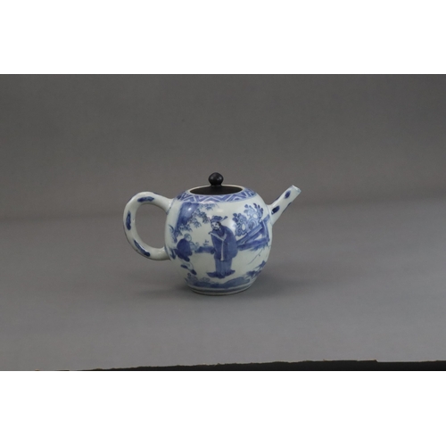 72 - A Blue and White Figural Teapot and wood cover, Chongzhen  painted in soft tones on the globular sid... 