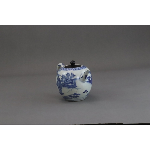 72 - A Blue and White Figural Teapot and wood cover, Chongzhen  painted in soft tones on the globular sid... 