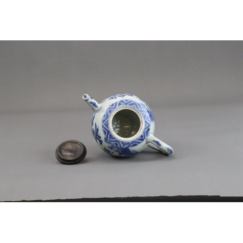 72 - A Blue and White Figural Teapot and wood cover, Chongzhen  painted in soft tones on the globular sid... 