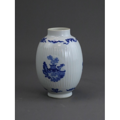 74 - A Blue and White Inscribed Jar, possibly Kangxi, of ovoid form, the fluted sides with three circular... 