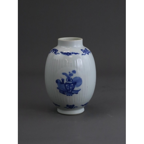 74 - A Blue and White Inscribed Jar, possibly Kangxi, of ovoid form, the fluted sides with three circular... 