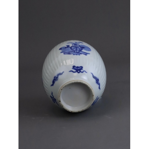 74 - A Blue and White Inscribed Jar, possibly Kangxi, of ovoid form, the fluted sides with three circular... 