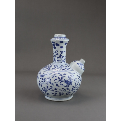 75 - A Rare Blue and White Kendi, Chongzhen, well painted in soft tones of blue with a continuous delicat... 