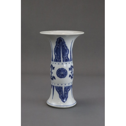 77 - A Blue and White Beaker Vase, Kangxi, the neck and lower body both painted with stylised plantain la... 