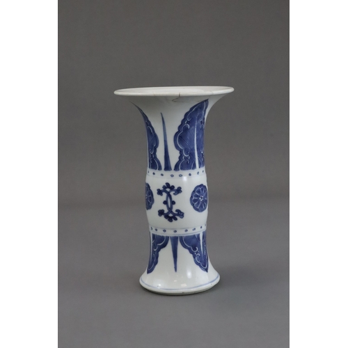 77 - A Blue and White Beaker Vase, Kangxi, the neck and lower body both painted with stylised plantain la... 